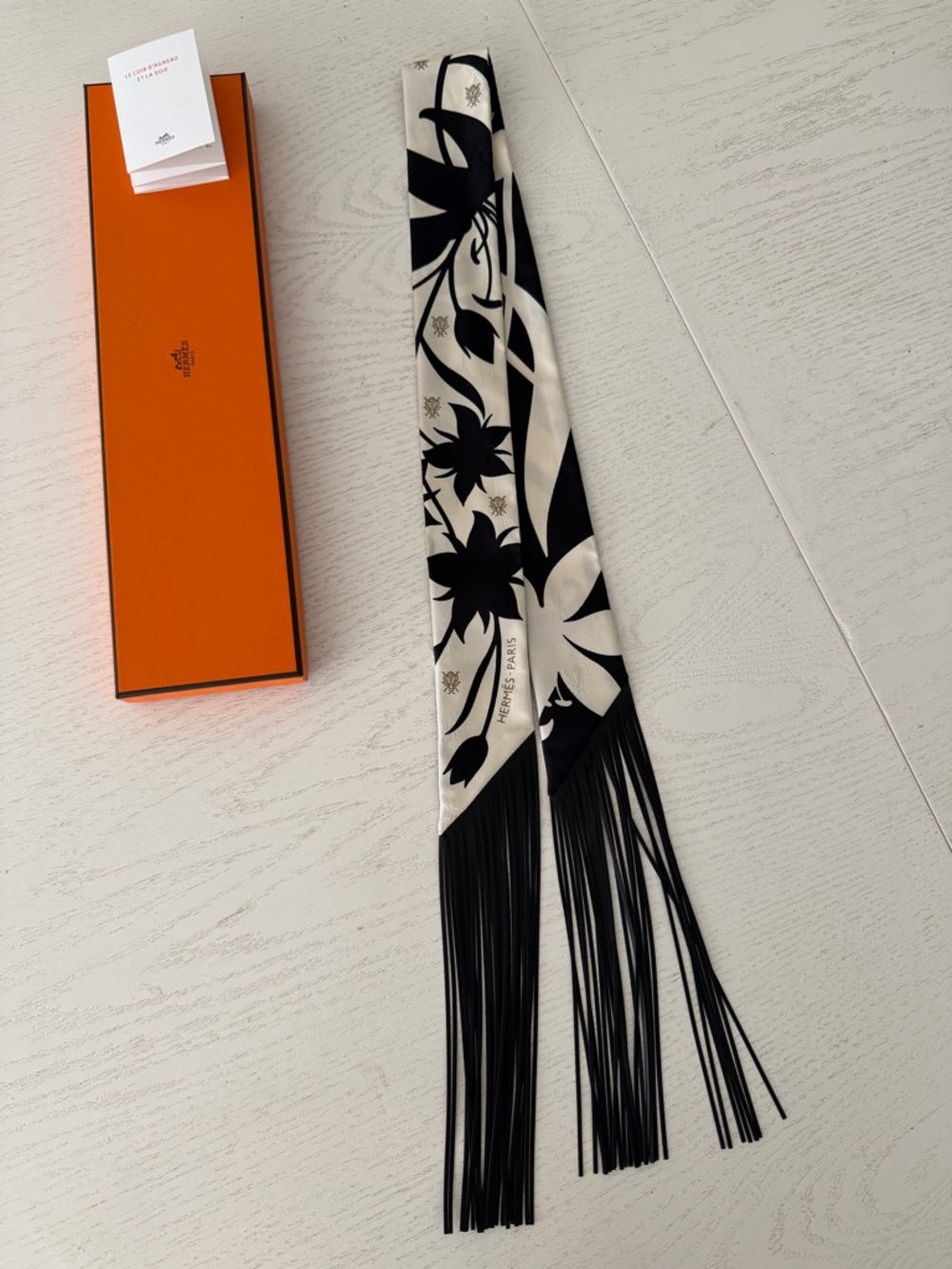 Hermes Black and Cream Silk Leather Fringed Twilly with Floral Motif
